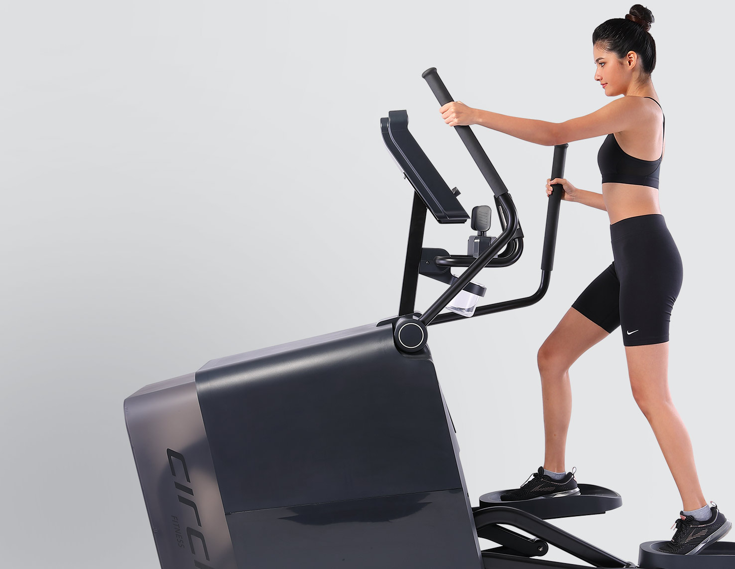 woman on elliptical machine