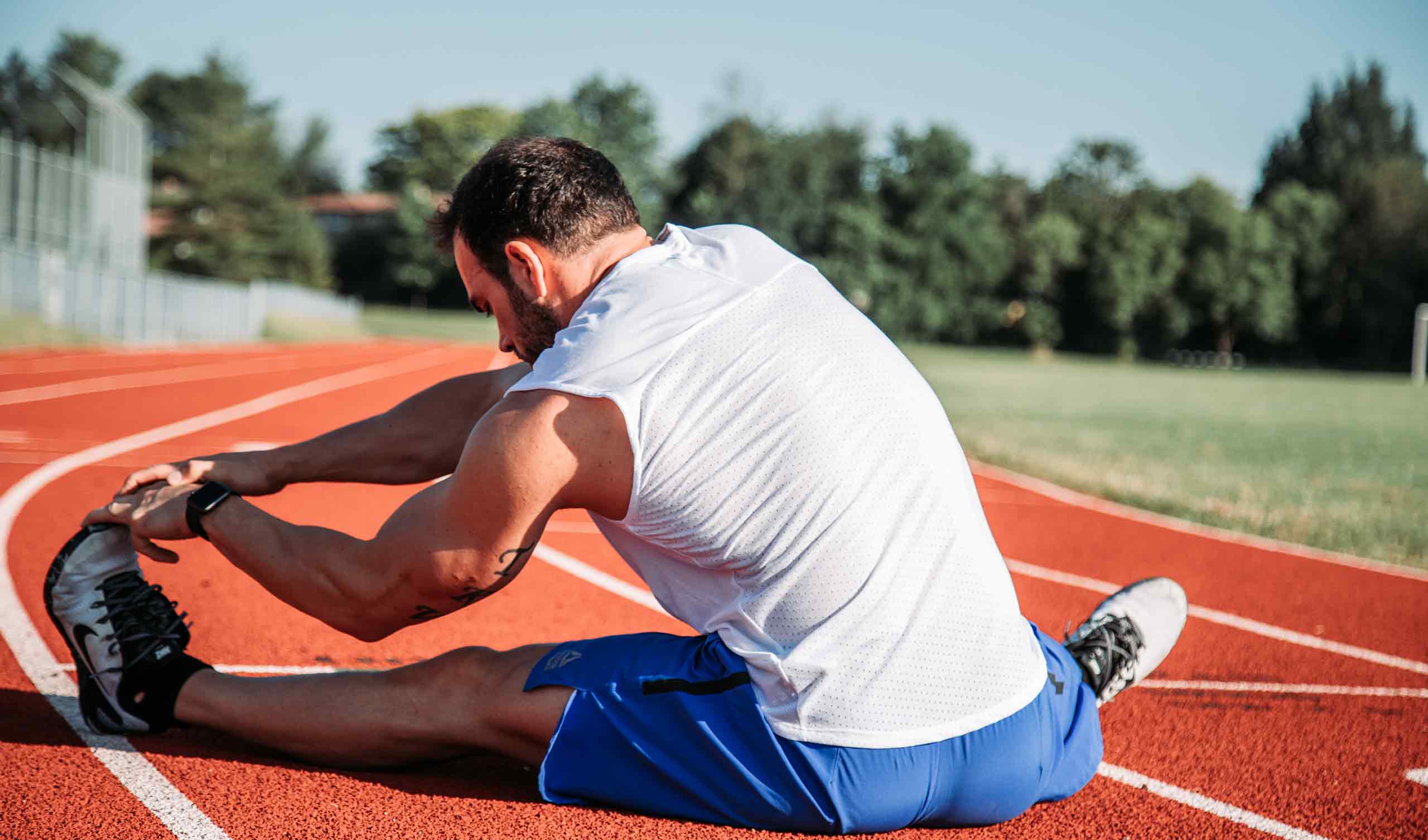 a person stretches before running