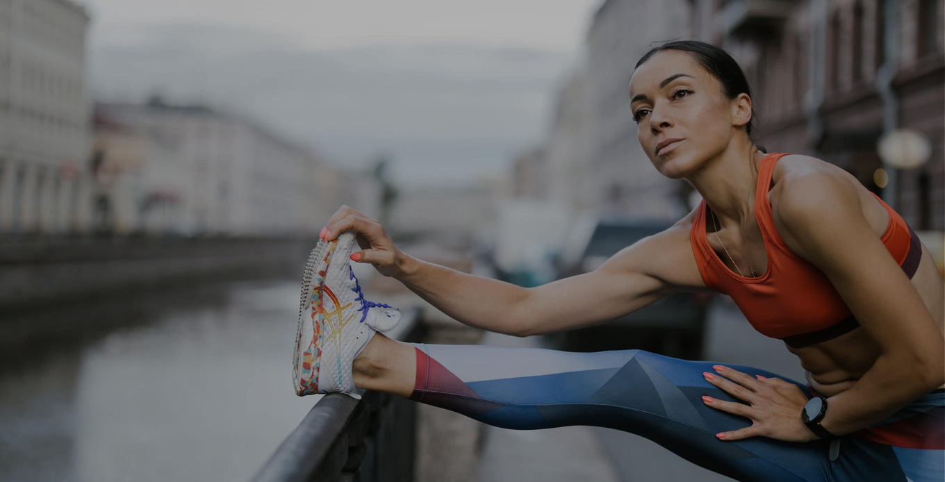 a person stretches before running